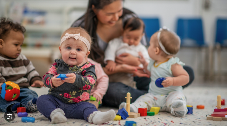 Infants playing on floor