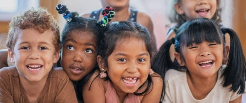Five preschool children smiling