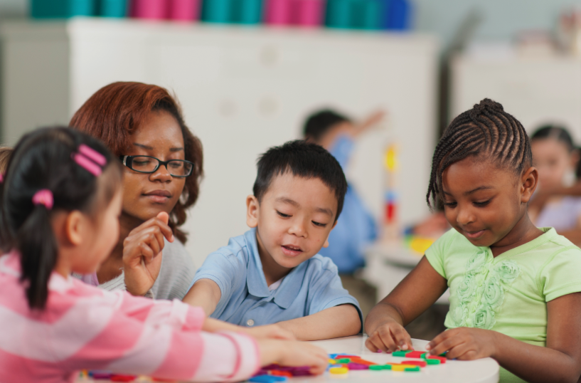 Teacher doing crafts with children