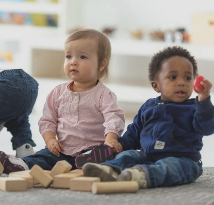 Toddler pair with wooden blocks